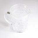 transparent blown glass jug