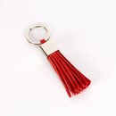 key ring in red suede with fringes designed by Jan Philippi