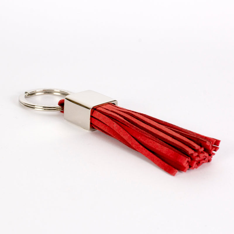key ring in red suede with fringes designed by Jan Philippi
