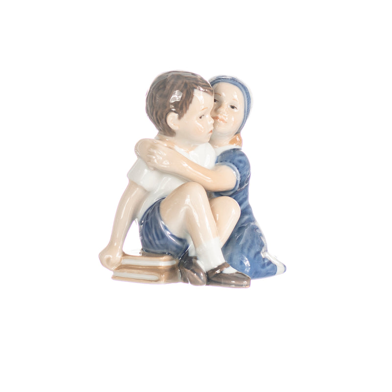 figurine hugging children in hand decorated porcelain