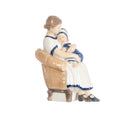 little girl with mother figurine in hand decorated porcelain