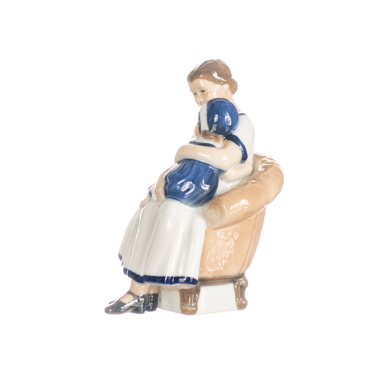 little girl with mother figurine in hand decorated porcelain