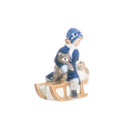 little girl figurine on sleigh in hand decorated porcelain