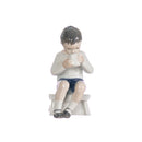 figurine baby seated in hand decorated porcelain