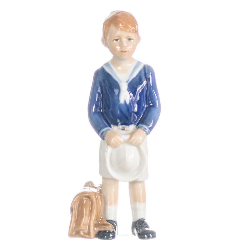 figurine schoolboy boy in hand decorated porcelain