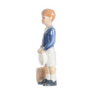 figurine schoolboy boy in hand decorated porcelain