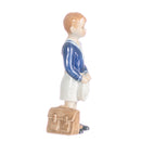 figurine schoolboy boy in hand decorated porcelain