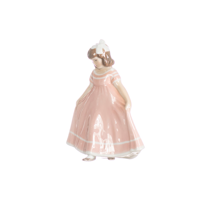pink girl figurine in hand decorated porcelain