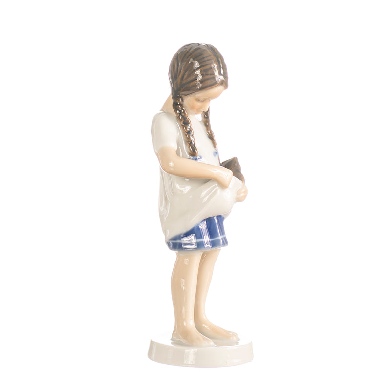 little girl figurine with braids in hand decorated porcelain