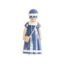 little girl figurine with hand decorated porcelain handbag