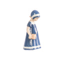 little girl figurine with hand decorated porcelain handbag