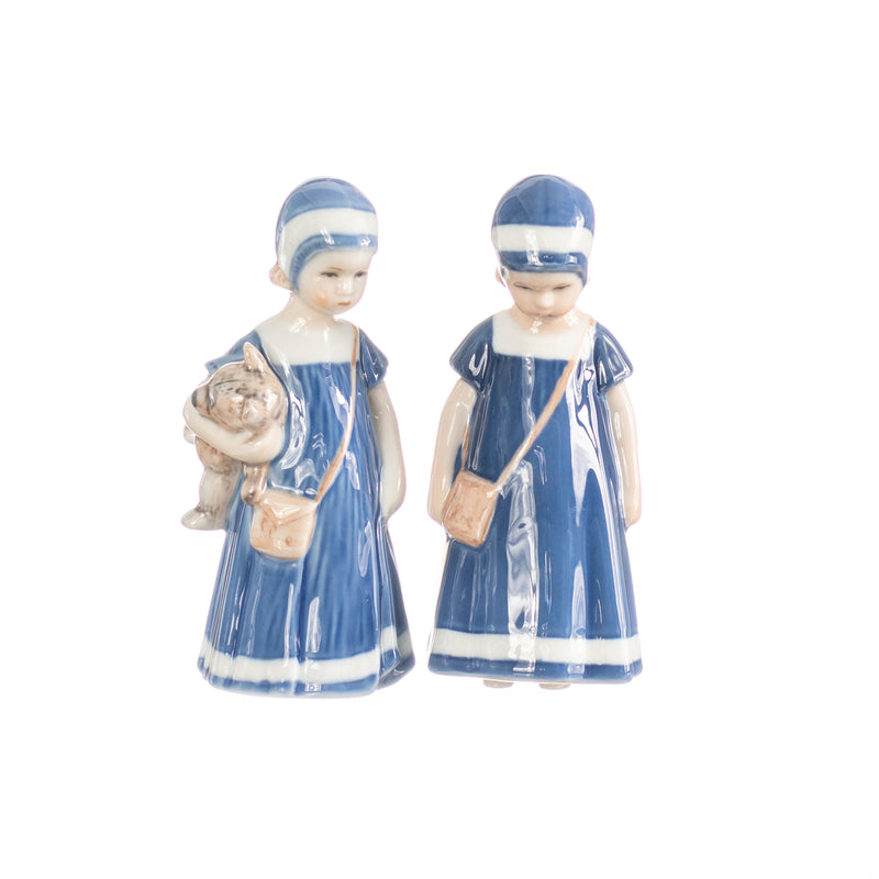 little girl figurine with hand decorated porcelain handbag