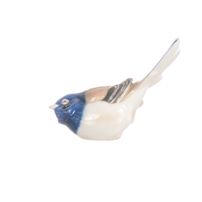 figurine little bird with upturned tail in hand decorated porcelain