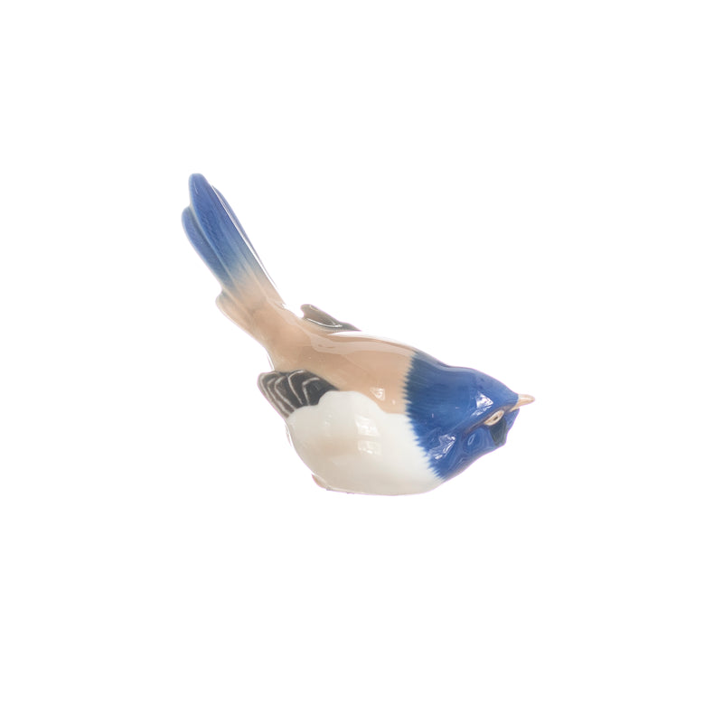 figurine little bird with upturned tail in hand decorated porcelain